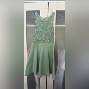 Mint green dress with lace and structured skirt